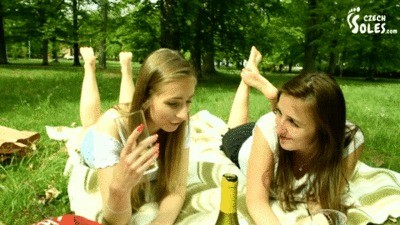 Two Barefoot Girls In Park Having Their Feet Worshiped By A Stranger