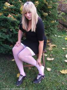 Taking Off Black Sneakers And White Nylon Stockings